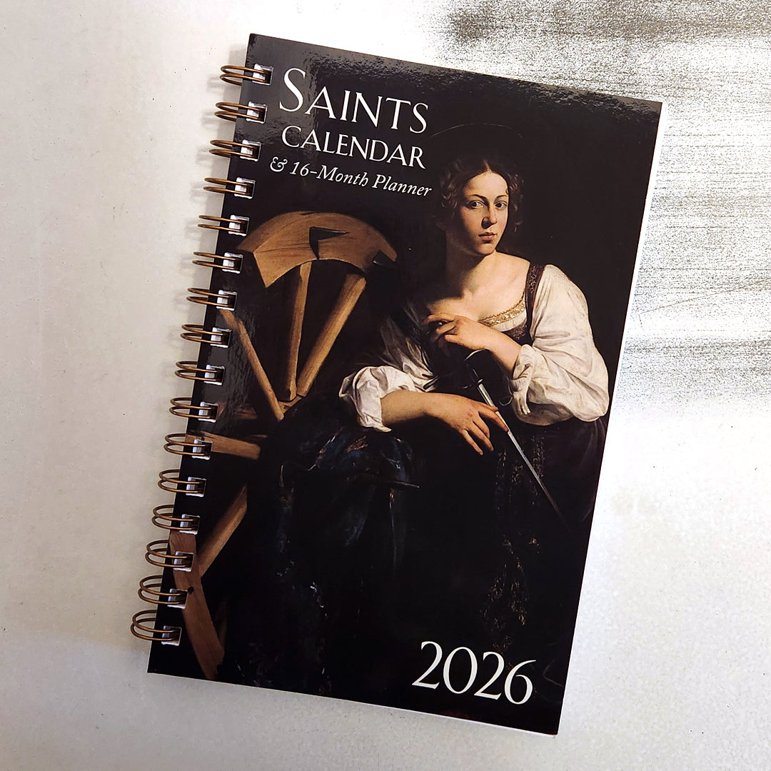 2026 Saints calendar and 16-month planner with a classical painting cover on a light background