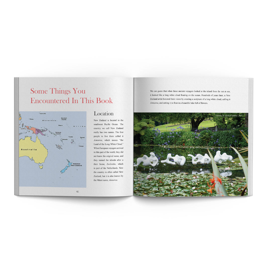 Open book with a map and photograph of swans on a pond